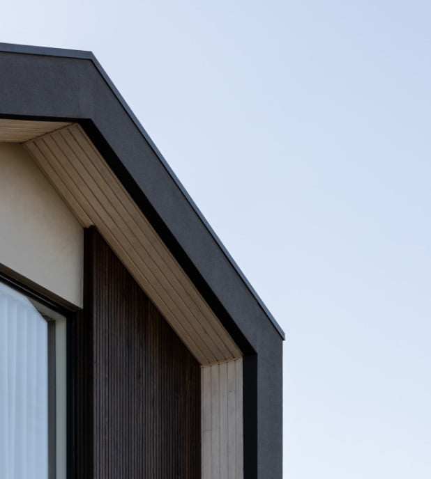 Arli homes Luca display home. Roof detail zoomed in on timber paneling and gable.